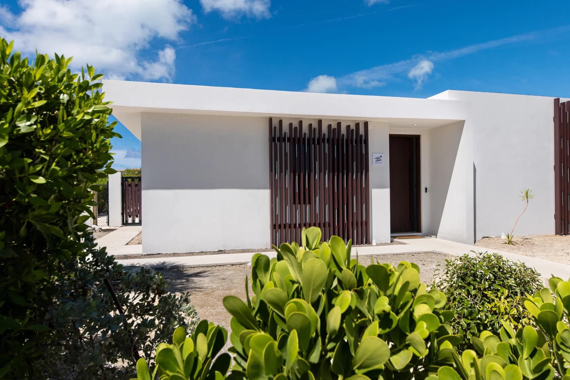 Entrance to La Villa di Bella framed by tropical planting